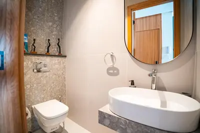 a bathroom with a sink and a toilet and a mirror at KeyLiving 501 3 pers Emplacement Top Wifi in Casablanca