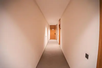 a hallway with white walls and a long corridor at KeyLiving 501 3 pers Emplacement Top Wifi in Casablanca