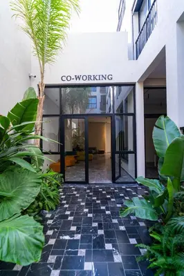 a building with a sign that reads co working at CFC Skyline View Luxury Private Parking - Netflix in Casablanca