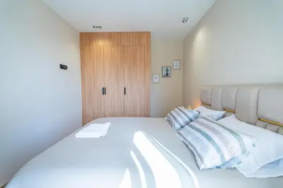 a bedroom with a large white bed with two pillows at CFC Skyline View Luxury Private Parking - Netflix in Casablanca