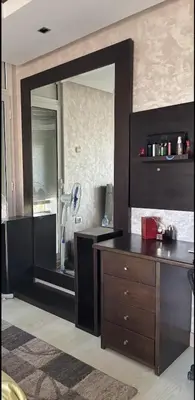 a mirror in a room with a dresser and a desk at Villa de luxe CGI avec piscine in Bouskoura