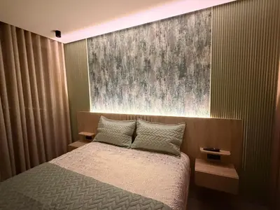 a bedroom with a bed and a painting on the wall at CityZen in Casablanca