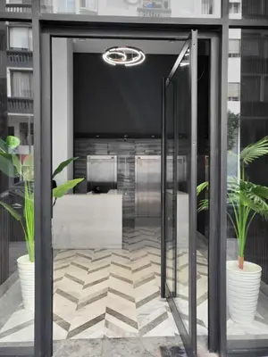 an office with a glass door with two potted plants at O'Blu Pearl Casablanca Center, Morocco in Casablanca