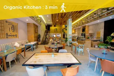 a restaurant with tables and chairs and a staircase at Luxury central Apartment - 3BR - Flipper - Parking in Casablanca