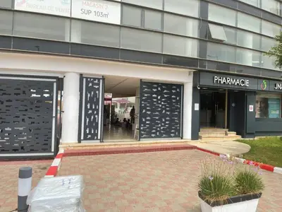 a store front of a building with its doors open at Magnifique Appartement à Louer C14 Jnane Dalya in Bouznika