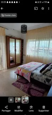 a picture of a bedroom with a bed in a room at Appartement à louer Aux perles de tamaris in Tamaris