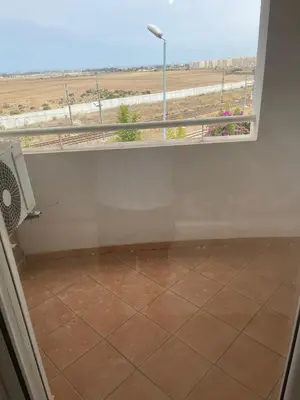 a room with a window and a tiled floor at Superbe Appartement à Louer C14 Jnane Dalya in Bouznika