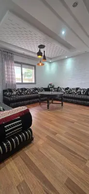a room with couches and tables in a room at appartement luxe dt3 in Mohammedia