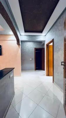 an empty room with a tile floor and a ceiling at appartement calme dt4 in Mohammedia