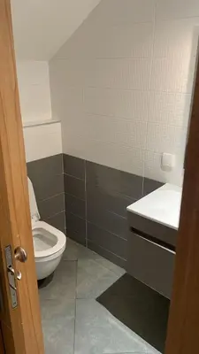 a bathroom with a toilet and a sink at Appart hôtel las jemelas in Casablanca