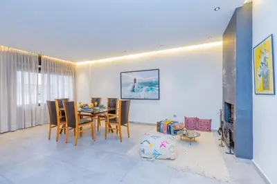 a dining room with a table and chairs at Casablanca City Center Loft, 3 BR, Parking, AC & Terrasse in Casablanca