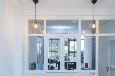 a room with three lights hanging from the ceiling at Casablanca City Center Loft, 3 BR, Parking, AC & Terrasse in Casablanca