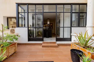 an entrance to a building with large glass doors at Casablanca City Center Loft, 3 BR, Parking, AC & Terrasse in Casablanca