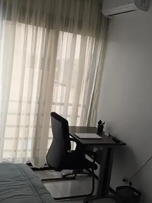 a desk with a chair in front of a window at Studio Rabat in Rabat