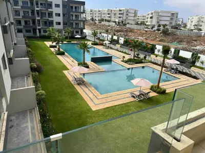 an overhead view of a swimming pool in a apartment at 3 bedrooms in El Mansouria with pool beach terrace in Pont Blondin