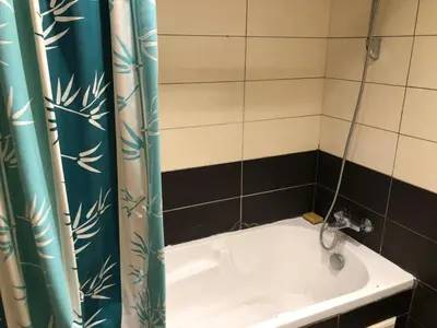 a bath tub with a shower curtain in a bathroom at Park Plaza studio quiet comfort No one opposite in Mohammedia