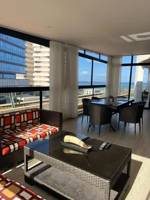 a living room with a couch and a table at Beautiful Ocean view Marina Casablanca in Casablanca
