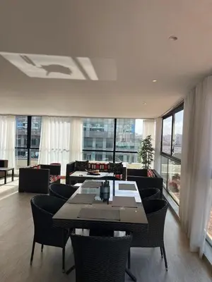 a living room with a table and chairs at Beautiful Ocean view Marina Casablanca in Casablanca