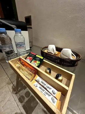 a coffee table with books and two bottles of water at Bohemian Oasis in Casablanca