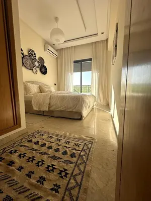 a bedroom with a bed and a rug on the floor at Bohemian Oasis in Casablanca