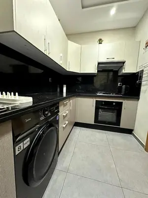a kitchen with a washer and a dishwasher at Bohemian Oasis in Casablanca