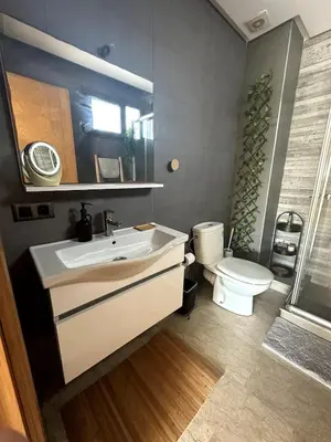 a bathroom with a sink and a toilet at Bohemian Oasis in Casablanca