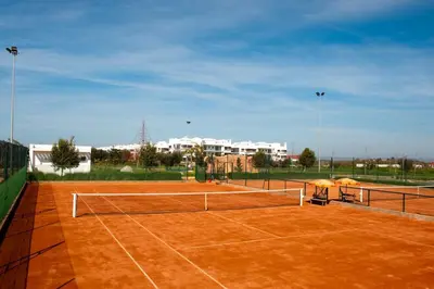 a tennis court with a net on top of it at Pearl Of Eden Island in Bouznika