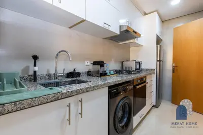 a kitchen with a sink and a washing machine at Prestige APT Style & elegant RABAT by MERAT HOME in Rabat