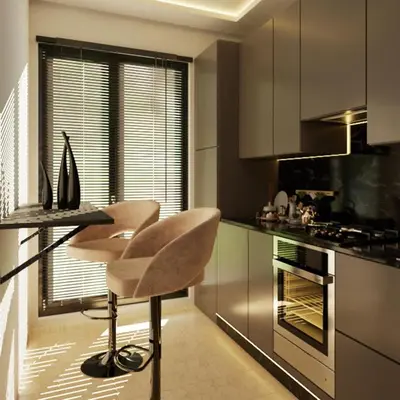 a kitchen with a counter and a table and chairs at Appartement spacieux et calme - ain chock CASAblanca in Casablanca