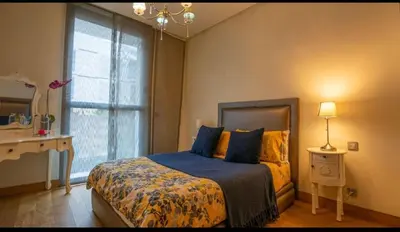 a bedroom with a bed and a window at Cosy home in Casablanca