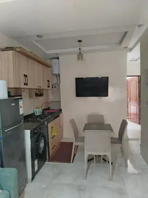a kitchen with a table and a dining room at Calme large studio in Casablanca