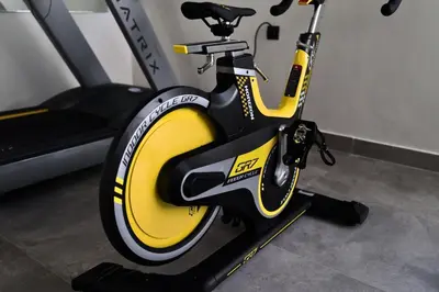 a yellow and black bike parked in a gym at CFC Modern Studio Emplacement Face à Anfa Park in Casablanca