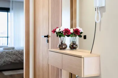 two vases with flowers on a shelf in a room at CFC Modern Studio Emplacement Face à Anfa Park in Casablanca