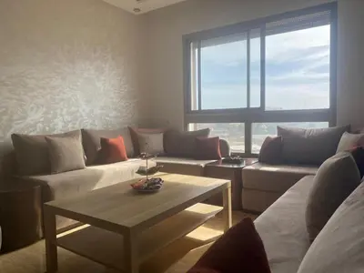a living room with two couches and a coffee table at Bright & Cozy Apartment in Casablanca