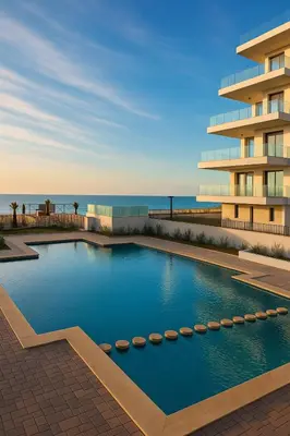 a swimming pool in front of a building at L' Evasion BLeu au Carroussel in Rabat