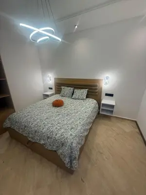 a bedroom with a bed with a pumpkin on it at Modern Studio in Hay Riad All Comfort in Rabat