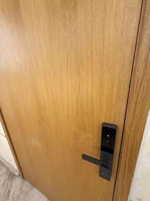 a close up of a wooden door with a handle at Modern Studio in Hay Riad All Comfort in Rabat