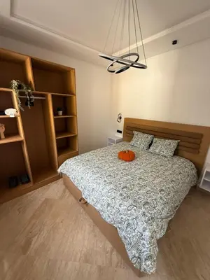 a bedroom with a bed with a pumpkin on it at Modern Studio in Hay Riad All Comfort in Rabat