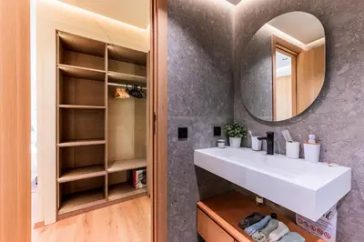 a bathroom with a sink and a mirror at Appartement Cosy neuf - Salle de sport in Casablanca