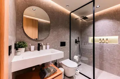 a bathroom with a sink and a mirror at Appartement Cosy neuf - Salle de sport in Casablanca