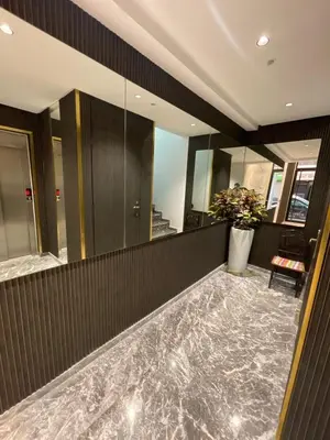 a lobby of a building with a vase of flowers at Luxury studio Maarif à 5 min CFC in Casablanca