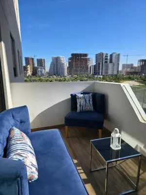 a living room with two chairs and a table at apartment luxe dt7 in Casablanca