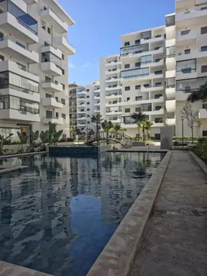 a swimming pool in front of two apartment buildings at apartment luxe dt7 in Casablanca