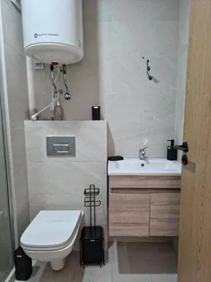 a small bathroom with a toilet and a sink at apartment luxe dt7 in Casablanca