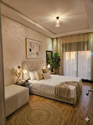 a bedroom with a large bed and a window at Casablanca premium Suite,wifi,parking in Casablanca