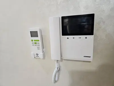 a white phone is attached to a wall at Casablanca premium Suite,wifi,parking in Casablanca