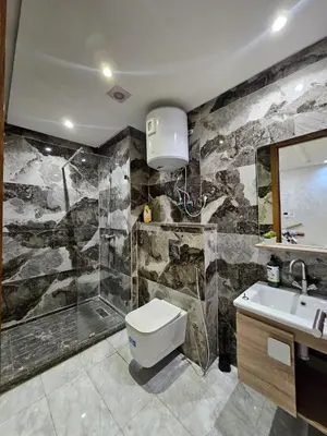 a bathroom with a toilet and a sink and a shower at Casablanca premium Suite,wifi,parking in Casablanca