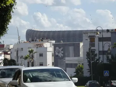 a white car parked in front of a building at Appartement meuble rabat in Rabat