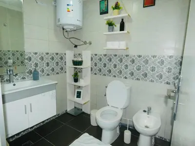 a small bathroom with a toilet and a sink at Appartement meuble rabat in Rabat