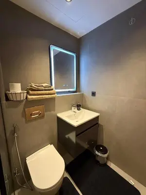 a bathroom with a toilet and a sink and a window at Cozy Modern Studio Near Stadium Mohammed V in Casablanca